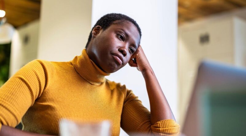 Young woman tired of computer.